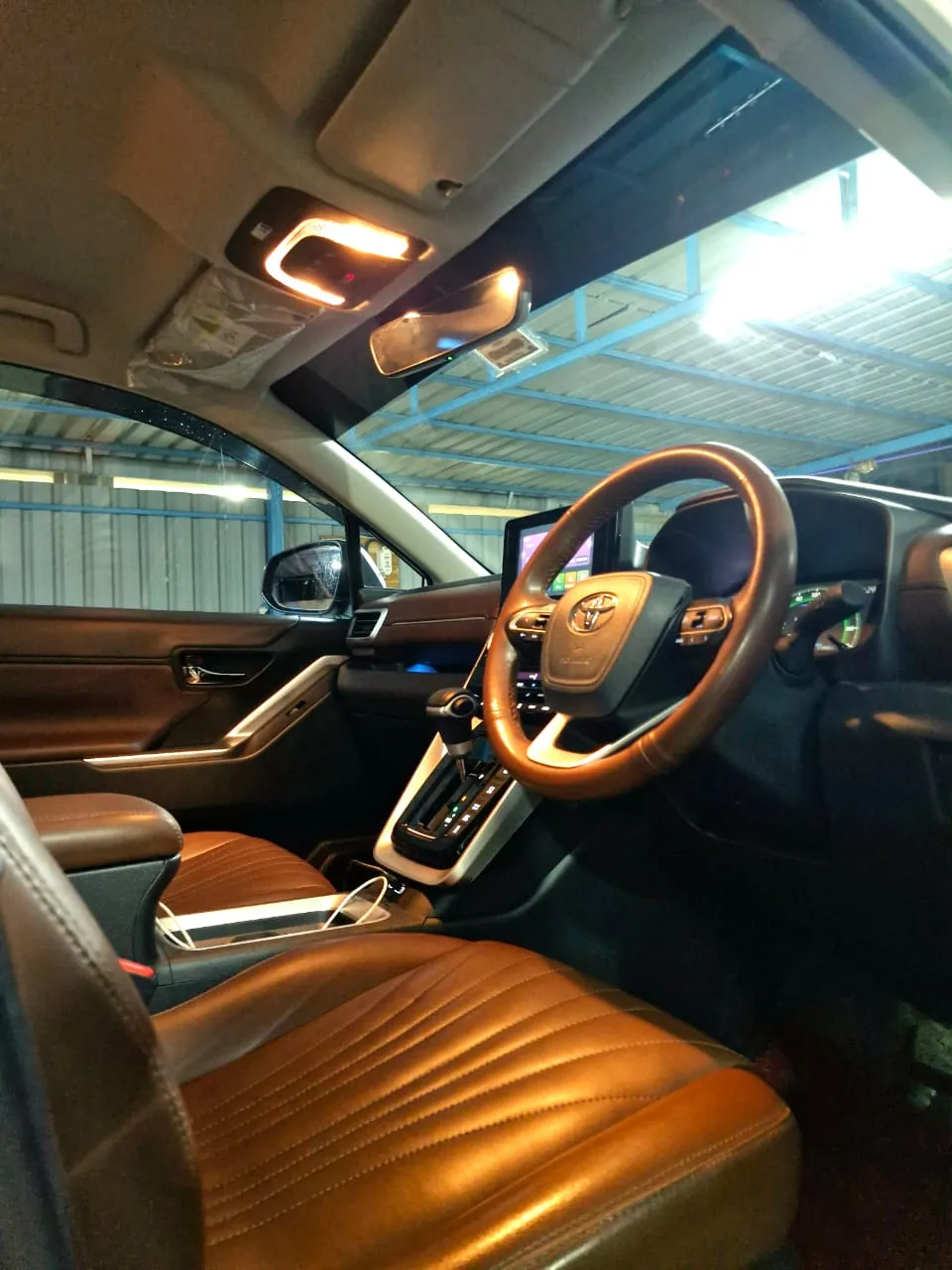 Luxury wedding car interior with plush seats and screen