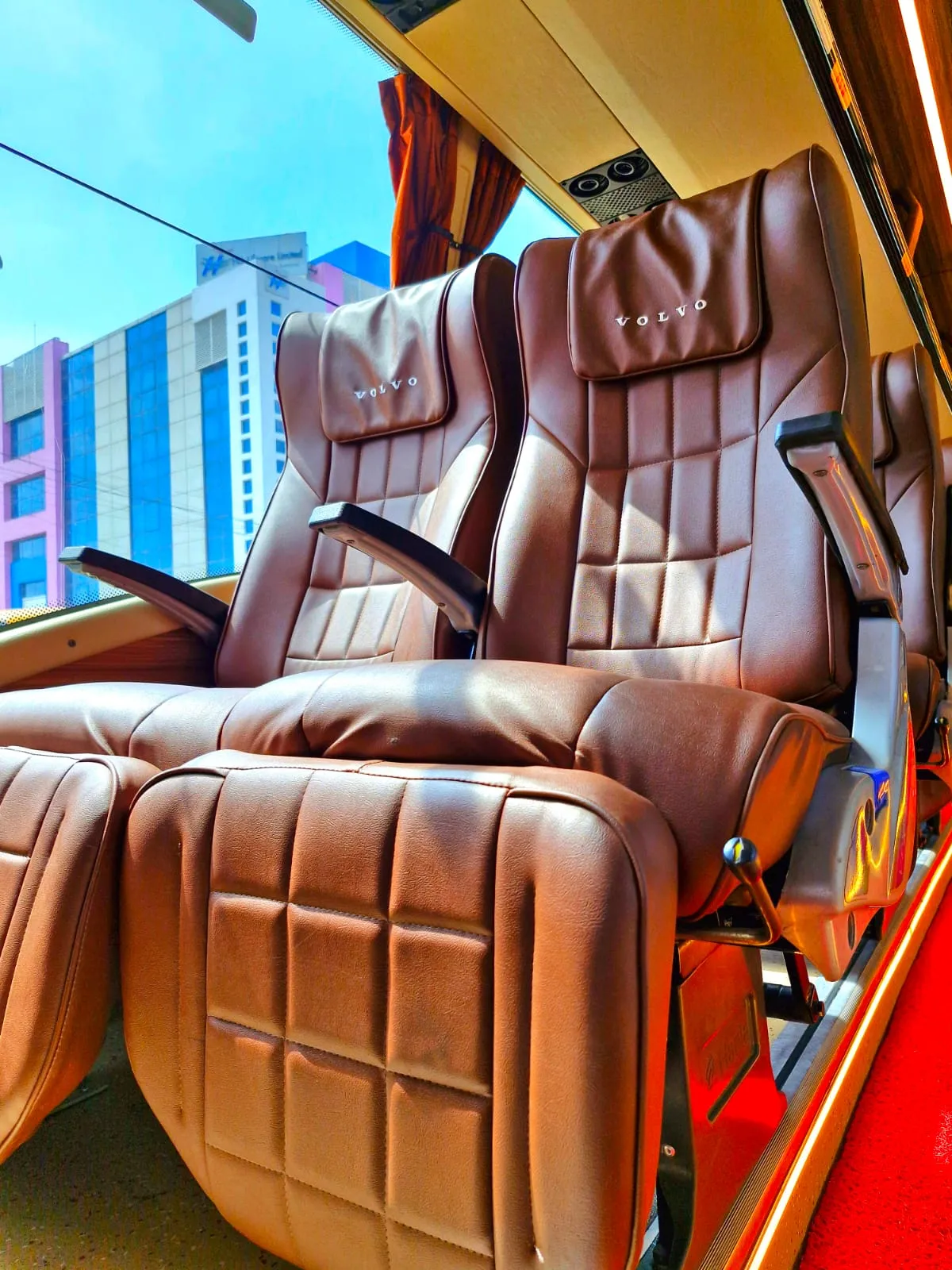 Luxury travel bus with AC, gear, and wide seating